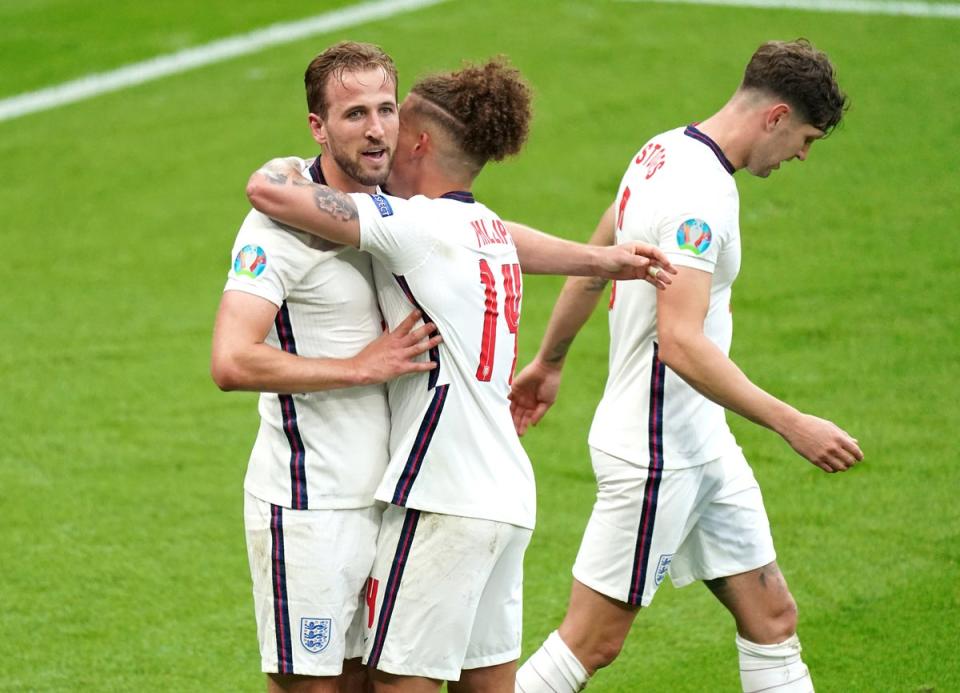 Phillips (centre, hugging captain Harry Kane) starred as England beat Germany at Euro 2020 last summer (Mike Egerton/PA) (PA Archive)