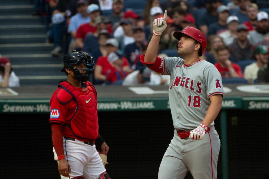 Cleveland Guardians’ Bo Naylo, left, looks on as Los Angeles Angels’ Nolan Schanuel (18) gestures after hitting a solo home run off Guardians starting pitcher Tanner Bibee during the third inning of a baseball game in Cleveland, Friday, May 3, 2024. (AP Photo/Phil Long)