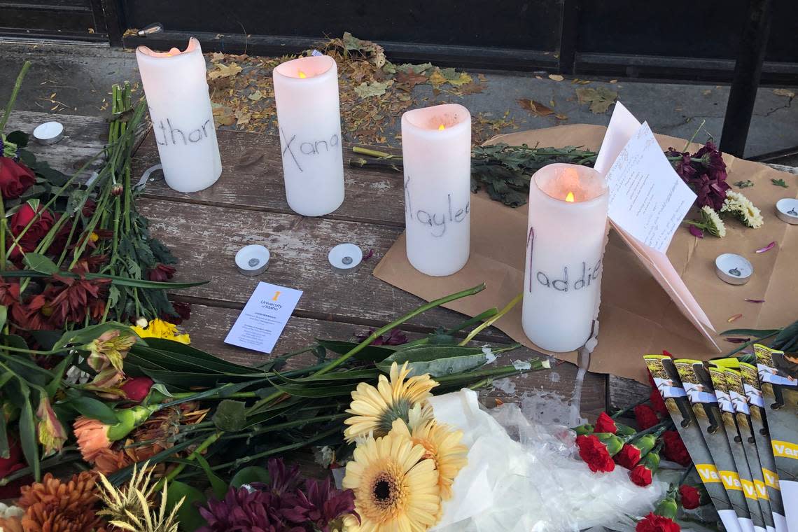 Candles and flowers are left at a makeshift memorial honoring four slain University of Idaho students outside the Mad Greek restaurant in downtown Moscow. Two of the victims worked at Mad Greek.