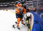 Los Angeles Kings' Matt Roy (3) is checked by Edmonton Oilers' Leon Draisaitl (29) during the second period of an NHL hockey game in Edmonton, Alberta, Sunday, Dec. 5, 2021. (Jason Franson/The Canadian Press via AP)