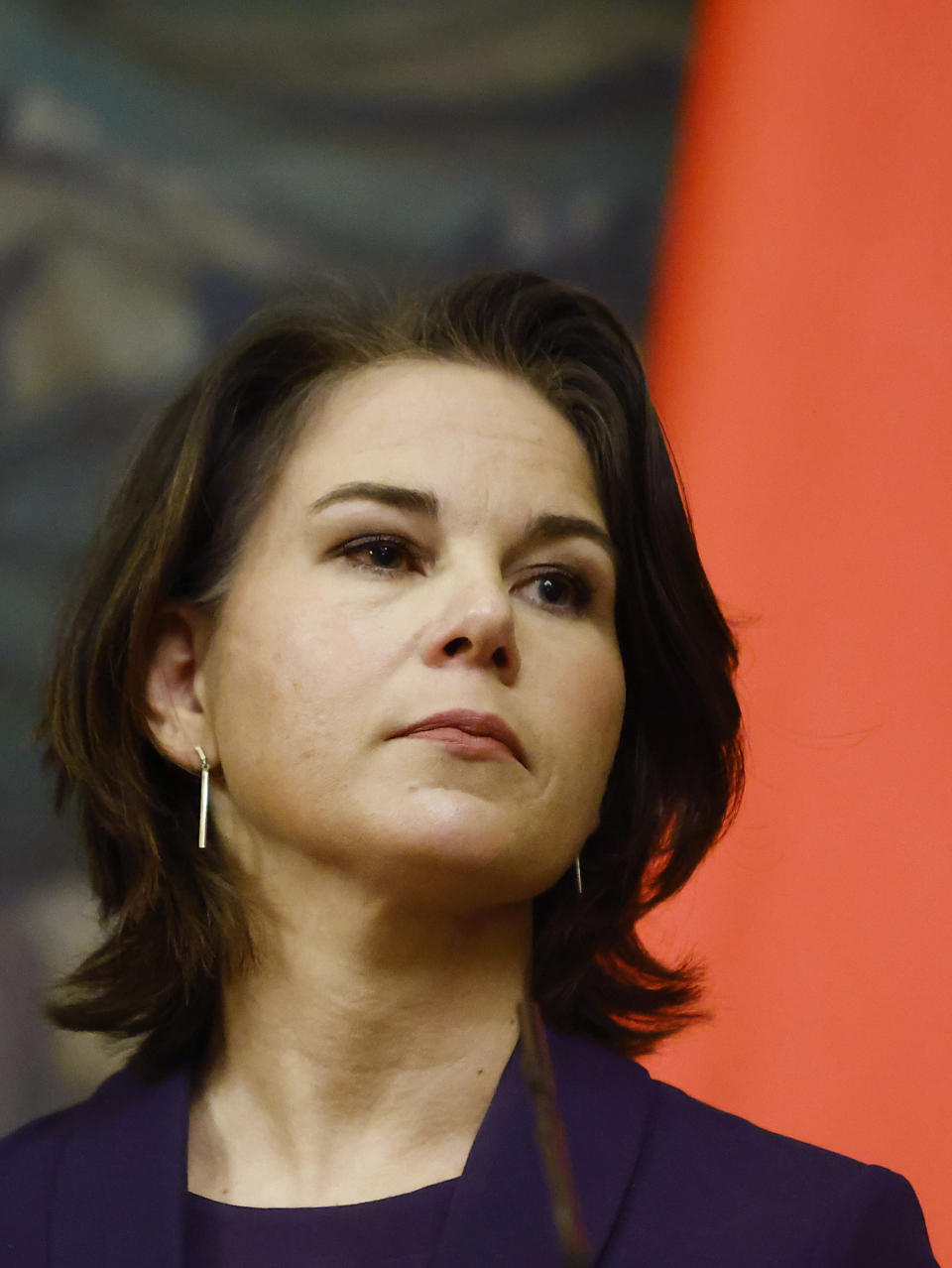 German Foreign Minister Annalena Baerbock listens during a joint news conference with Russian Foreign Minister Sergey Lavrov following their talks in Moscow, Russia, Tuesday, Jan. 18, 2022. (Maxim Shemetov/Pool Photo via AP)