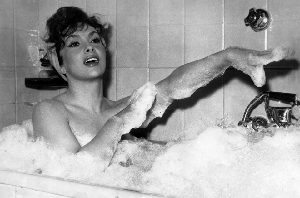 FILE - In this Dec. 5, 1957 file photo Italian actress Gina Lollobrigida takes a bubble bath in a scene of her film called 