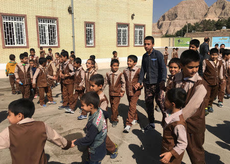 Iranian and Afghan boys play outside at the Be'sat school in Kerman, Iran, October 23, 2016. REUTERS/Gabriela Baczynska