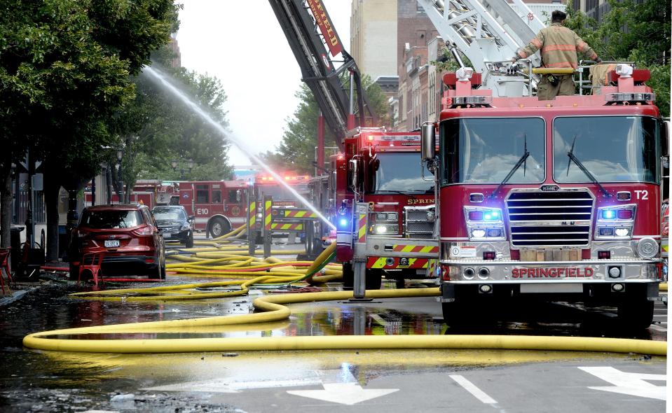 Springfield firefighters respond to a fire at 413 E. Adams St. on Wednesday, June 19, 2024, in Springfield.