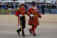 <p>A Yeomen of the Guard, right, and Gentlemen at Arms, left, members take their positions on Monday morning. (PA)</p> 