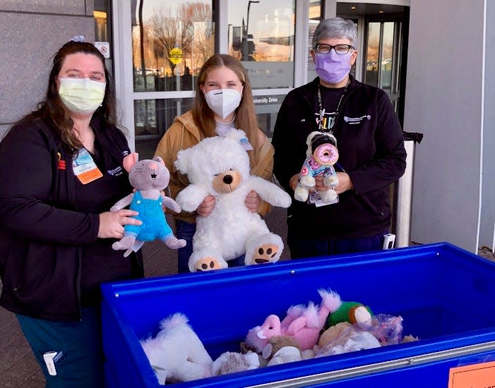 Taylor Putterman and her family, from the Hagerstown area, delivered a donation of 100 stuffed animals to Penn State Health Children’s Hospital in Hershey, Pa., on Wednesday morning. Pictured are Taylor, center, with Child Life Assistants Pam Baranowski, on the left, and Jenn Shearn, right.