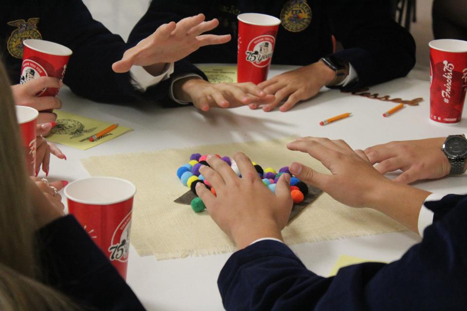 Ohio FFA President and OSU Student Luke Jennings used pom-poms to demonstrate prioritization skills to Zane Trace, Adena and Southeastern FFA students at Calvary Lutheran Church in Chillicothe, Ohio, on Oct. 2, 2023.