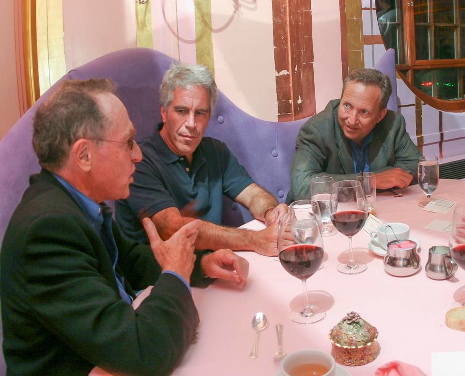 On Sept. 9, 2004, Jeffrey Epstein, center, hosted a dinner at Harvard University. With Epstein are Alan Dershowitz, foreground, and Lawrence Summers, the former treasury secretary and Harvard president.