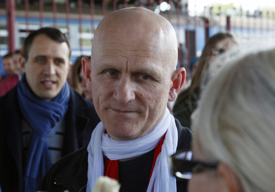 FILE - Belarusian human rights advocate Ales Bialiatski is welcomed by his supporters at a railway terminal in Minsk, Belarus, on Saturday, June 21, 2014. On Friday, Oct. 7, 2022 the Nobel Peace Prize was awarded to jailed Belarus rights activist Ales Bialiatski, the Russian group Memorial and the Ukrainian organization Center for Civil Liberties. (AP Photo/Dmitry Brushko, File)