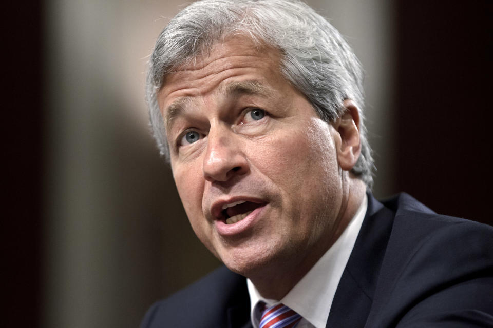 FILE - In this June 13, 2012 file photo, JPMorgan Chase CEO Jamie Dimon testifies before the Senate Banking Committee on Capitol Hill in Washington. Dimon on Tuesday, Oct. 14, 2014 said that more coordination between businesses and government is needed to combat the rising threat of cyberattacks. (AP Photo/J. Scott Applewhite, File)