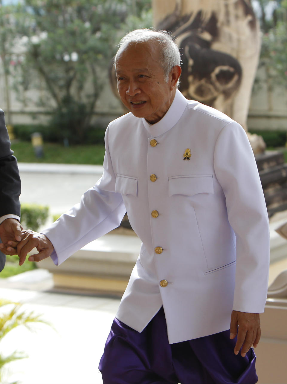 FILE- Prince Norodom Ranariddh enters to the National Assembly, in Phnom Penh, Cambodia, on Nov. 28, 2017. Ranariddh, former prime minister and the son of the late King Norodom Sihanouk, died Sunday, Nov. 28, 2021 in France, Information Minister Khieu Kanharith announced on his Facebook page. He was 77. (AP Photo/Heng Sinith, File)