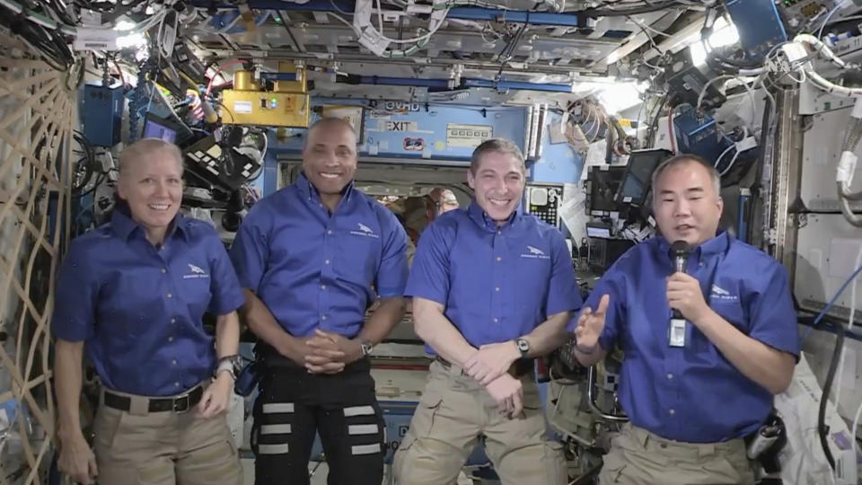 From left, NASA’s Shannon Walker, Victor Glover and Michael Hopkins, and Japan’s Soichi Noguchi hold a news conference aboard the International Space Station on Monday, April 26, 2021. They are winding up a six-month mission, after their replacements arrived Saturday on their own SpaceX capsule. (NASA via AP)