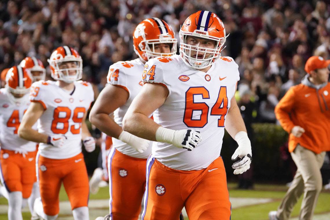 Clemson offensive lineman Walker Parks (64), who played in high school at Frederick Douglass, runs onto the field before a game against South Carolina on Nov. 27, 2021. The Tigers won 30-0.