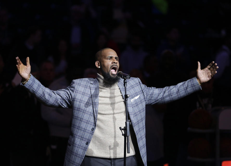 FILE - In this Nov. 17, 2015, file photo, musical artist R. Kelly performs the national anthem before an NBA basketball game between the Brooklyn Nets and the Atlanta Hawks in New York. An aunt who introduced her underage niece to Kelly and suspects abuse hoped in the six-part “Surviving R. Kelly” docuseries on Lifetime that the embattled star would propel the teen’s music career. She alleges the girl wound up on a sex tape instead. (AP Photo/Frank Franklin II, File)