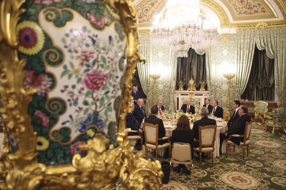 Cuban President Miguel Diaz-Canel, Tajik President Emomali Rahmon, Kyrgyz President Sadyr Japarov, Kazakh President Kassym-Jomart Tokayev, Belarusian President Alexander Lukashenko, Turkmen President Serdar Berdimuhamedov, Armenian Prime Minister Nikol Pashinyan, Russian President Vladimir Putin, Uzbek President Shavkat Mirziyoyev and other officials attend a working dinner following a meeting of the Eurasian Economic Union at the Kremlin in Moscow, Russia, on Wednesday, May 8, 2024. Russian President Vladimir Putin hailed the economic alliance's performance, saying that it helped boost the members' economic potential. (Alexander Kazakov, Sputnik, Kremlin Pool Photo via AP)