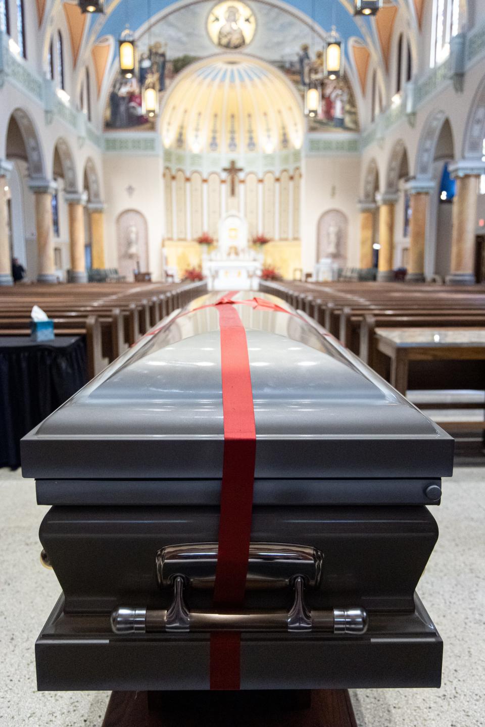 The casket of Stanley Rother is exhumed Sunday and driven to The Cathedral of Our Lady of Perpetual Help in Oklahoma City.