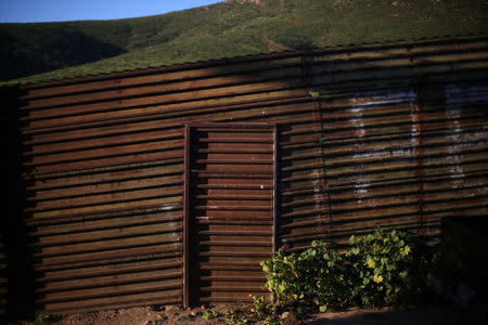 A section of the fence separating Mexico and the United States is seen, on the outskirts of Tijuana, Mexico. REUTERS/Edgard Garrido