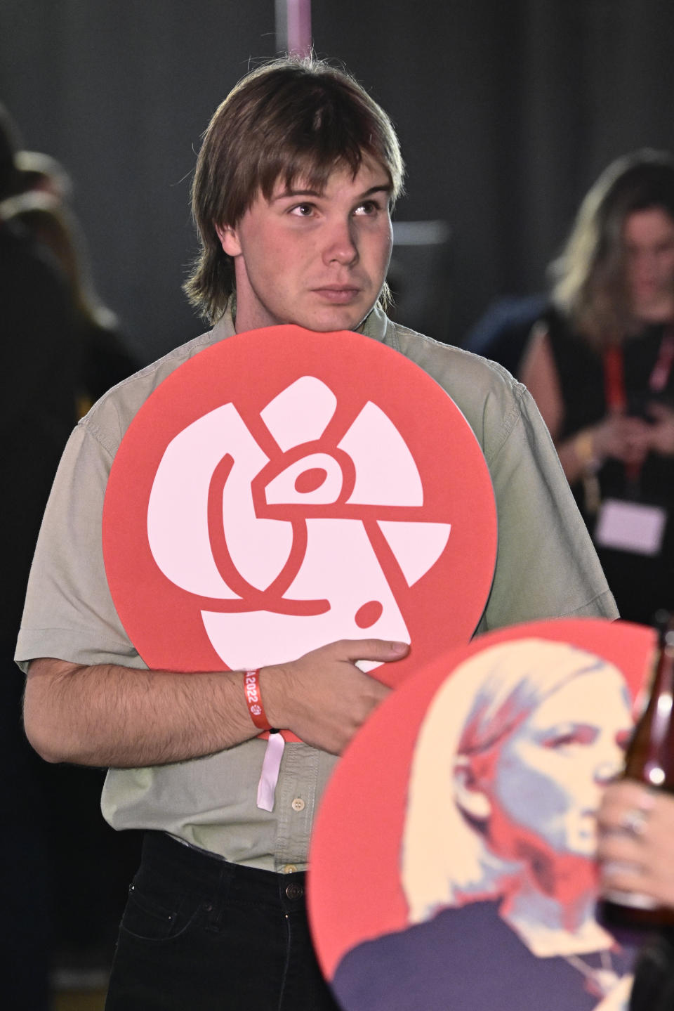 A disappointed supporter of the Social Democratic Party attends the the party's election watch at the Waterfront Conference Center in Stockholm, Sweden, Sunday evening, Sept. 11, 2022. An exit poll projected that Sweden’s ruling left-wing Social Democrats have won the most votes in a general election Sunday, while a right-wing populist party had its best showing yet. (Claudio Bresciani/TT News Agency via AP)