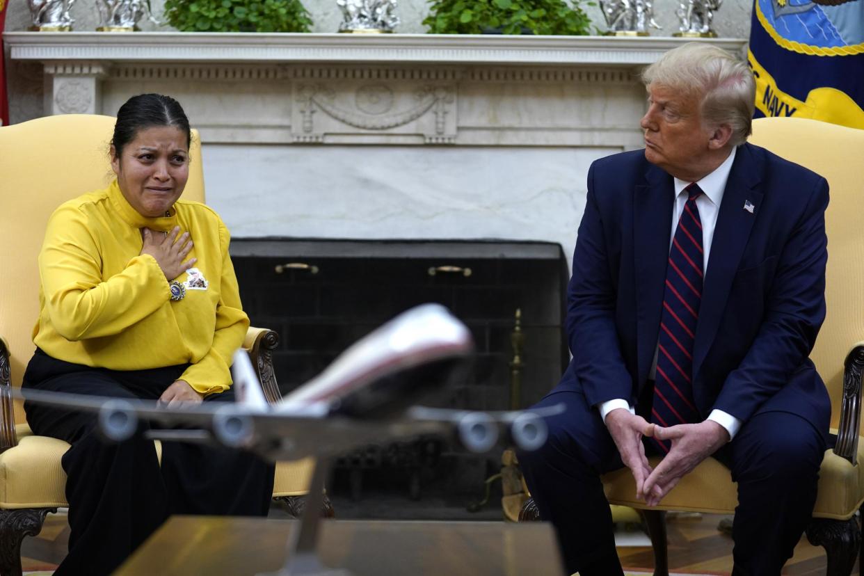 President Donald Trump meets with the family of slain Army Specialist Vanessa Guillen in the Oval Office of the White House on Thursday, 30 July, 2020: AP Photo/Evan Vucc