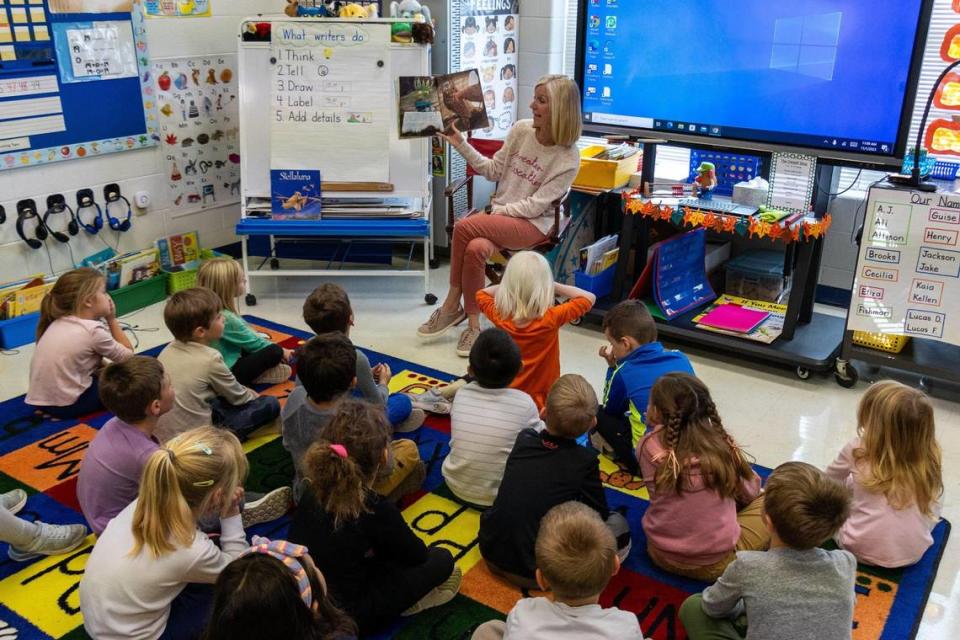 Tracie Guise, an Athens-Chilesburg Elementary school teacher, reads aloud from the book “The Scarecrow’s Hat” to her kindergarten class, Nov. 1, 2023. The school had the district's highest overall rating, according to the latest Kentucky School Report Card data.