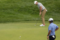 Rory McIlroy, of Northern Ireland, putts on the 12th hole during the first round of the U.S. Open golf tournament at The Country Club, Thursday, June 16, 2022, in Brookline, Mass. (AP Photo/Charlie Riedel)