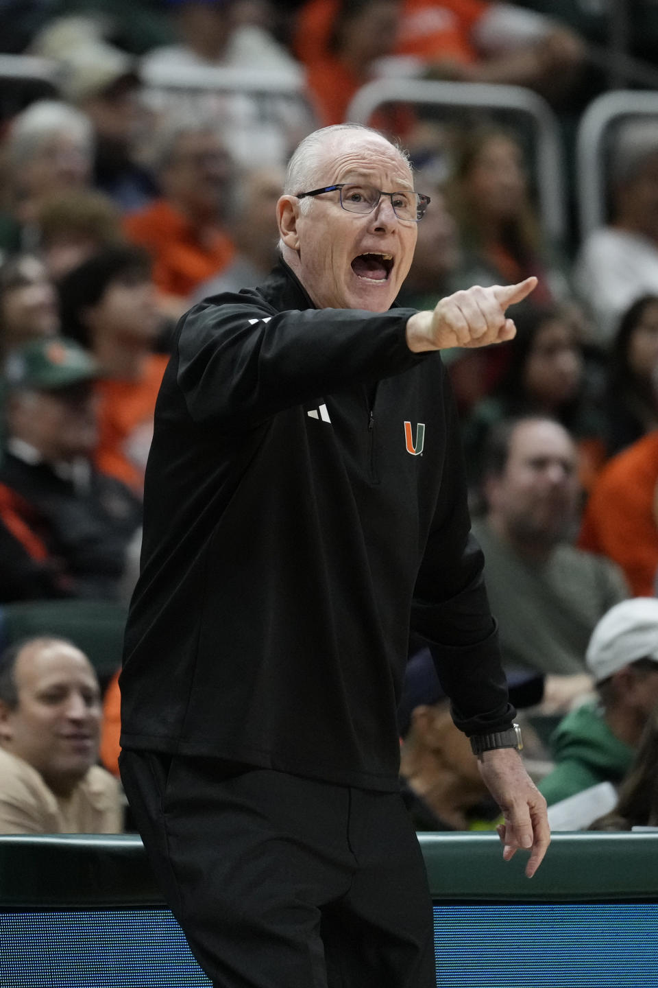 Miami head coach Jim Larranaga calls to his players during the first half of an NCAA college basketball game against La Salle, Saturday, Dec. 16, 2023, in Coral Gables, Fla. (AP Photo/Rebecca Blackwell)
