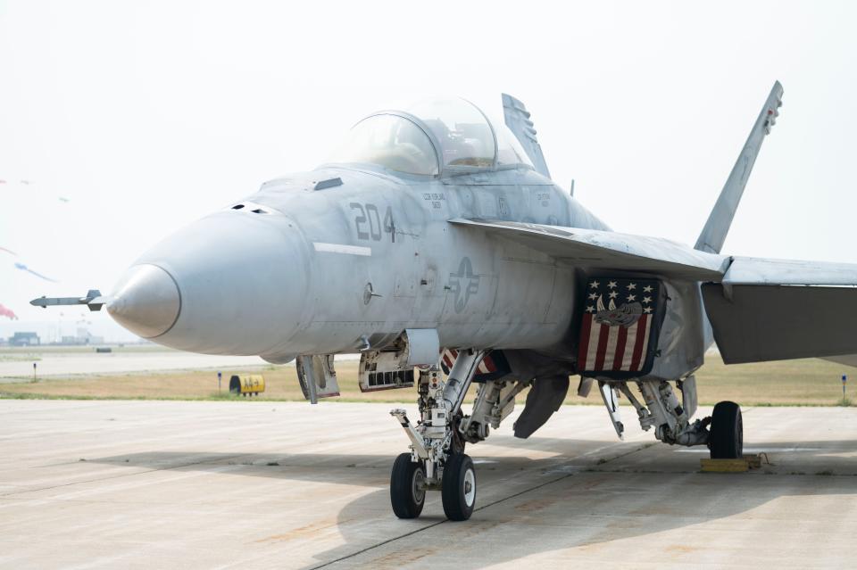 An F-18 Super Hornet aircraft arrives in preparation for the Field of Flight air show at Western Michigan University College of Aviation in Battle Creek on Thursday, June 29, 2023.