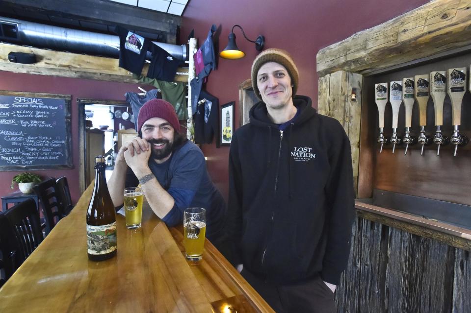 Jamie Griffith, left, and Allen Van Anda, co-founders of Lost Nation Brewing, are pictured in their taproom in Morrisville in 2015.