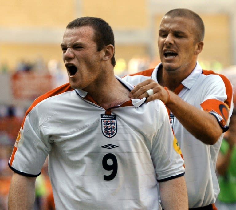 Wayne Rooney celebrates with teammate David Beckham at the Euro 2004 tournament in Portugal, where he scored four goals, aged 18