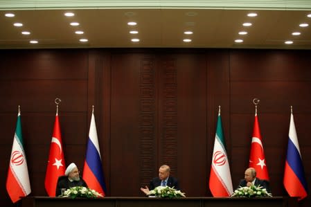 Turkish President Erdogan speaks during a joint news conference with his counterparts Rouhani of Iran and Putin of Russia in Ankara