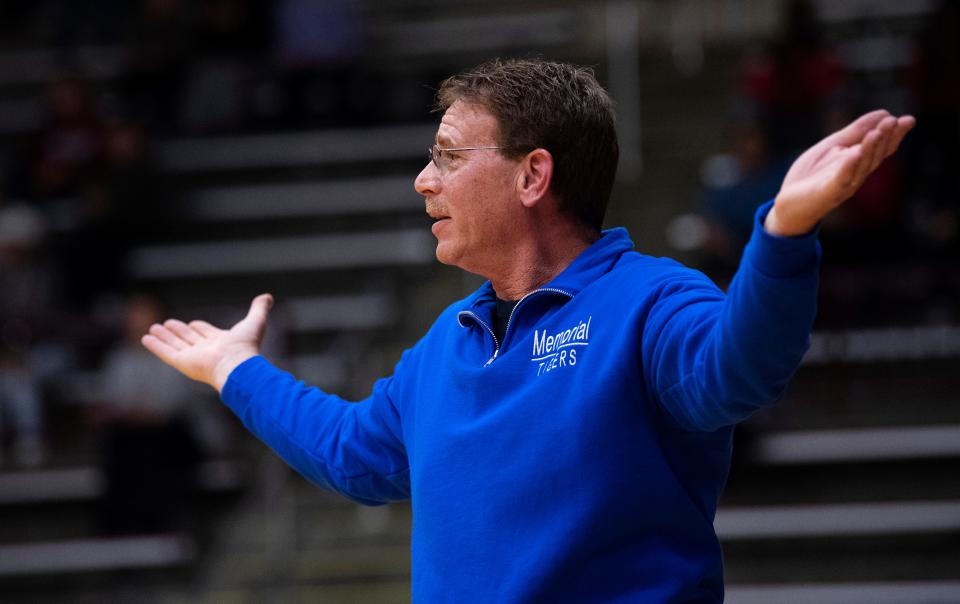 Memorial Head Coach Lee Auker looks to the referee for an explanation of a foul against his player during their Class 3A sectional championship game against Gibson Southern at Mount Vernon High School Monday night, Feb. 6, 2023.