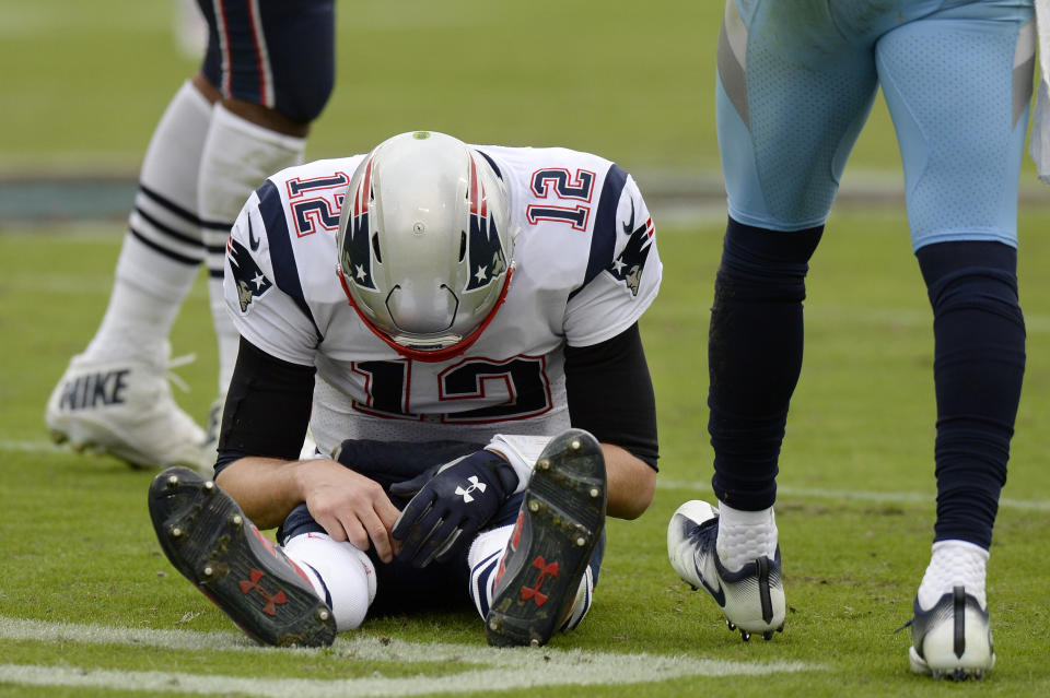 New England Patriots quarterback Tom Brady (12) sits on the turf after being sacked by the Tennessee Titans in the second half of an NFL football game Sunday, Nov. 11, 2018, in Nashville, Tenn. (AP Photo/Mark Zaleski)