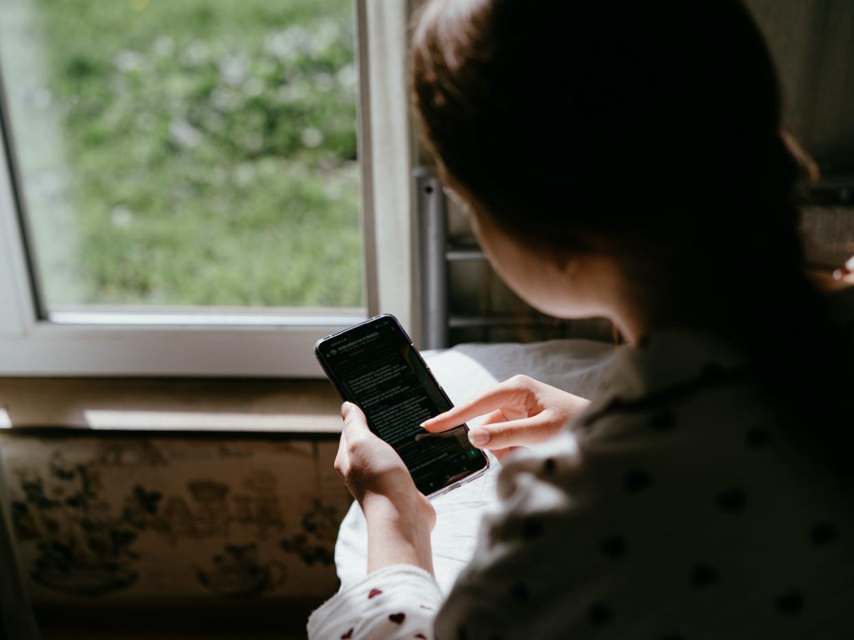 a girl looking at her phone