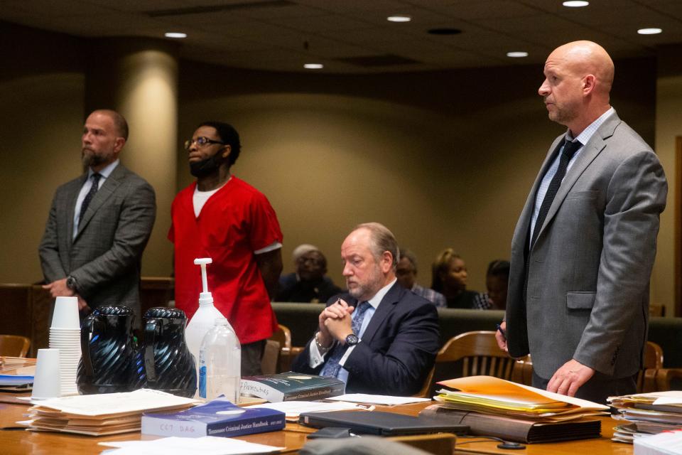Attorney Luke Evans and Justin Johnson, the man accused of shooting Young Dolph, listen as Assistant District Attorney Paul Hagerman (right) speaks to Judge Lee V. Coffee during an appearance for Johnson in the Shelby County Criminal Court in Memphis, Tenn., on Friday, July 14, 2023. 