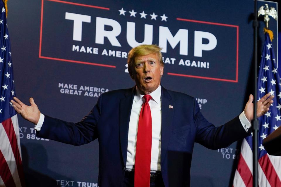 President Donald Trump reacts to the crowd as he arrives at a campaign rally, Thursday, April 27, 2023, in Manchester, N.H.