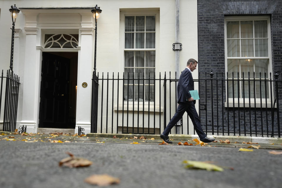 Britain's Chancellor Jeremy Hunt leaves 11 Downing Street to attend Parliament in London, Thursday, Nov. 17, 2022. Just three weeks after taking office, British Prime Minister Rishi Sunak faces the challenge of balancing the nation's budget while helping millions of people slammed by a cost-of-living crisis. Treasury chief Jeremy Hunt will deliver the government's plan for tackling a sputtering economy in a speech to the House of Commons on Thursday. (AP Photo/Alastair Grant)