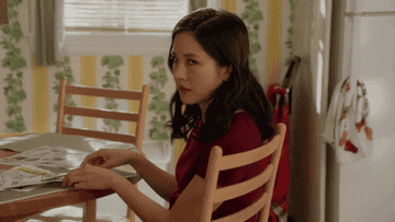 Constance Wu looks over her shoulder in shock on Fresh Off The Boat