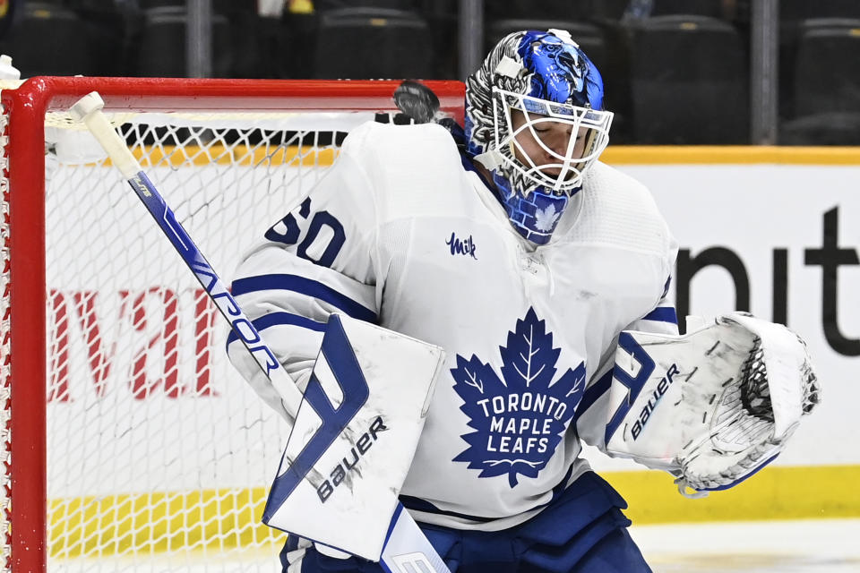 Toronto Maple Leafs goaltender Joseph Woll (60) defects a shot by the Nashville Predators off his shoulder pad during the second period of an NHL hockey game Sunday, March 26, 2023, in Nashville, Tenn. (AP Photo/Mark Zaleski)