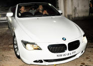 Karan and Gauri arrive in a BMW