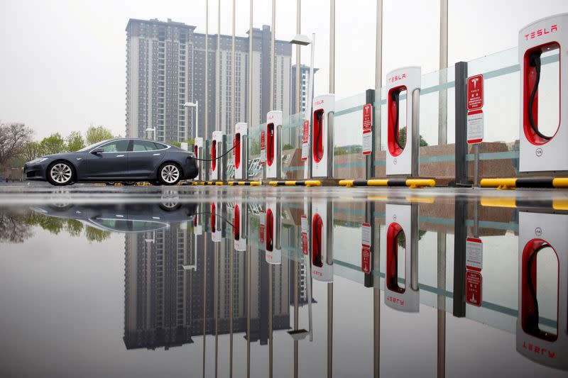 FILE PHOTO: A Tesla car pictured at a charging point in Beijing