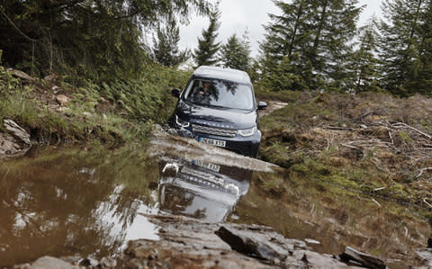 HMS Queen Elizabeth captain in Land Rover Discovery - Credit: Matt Howell