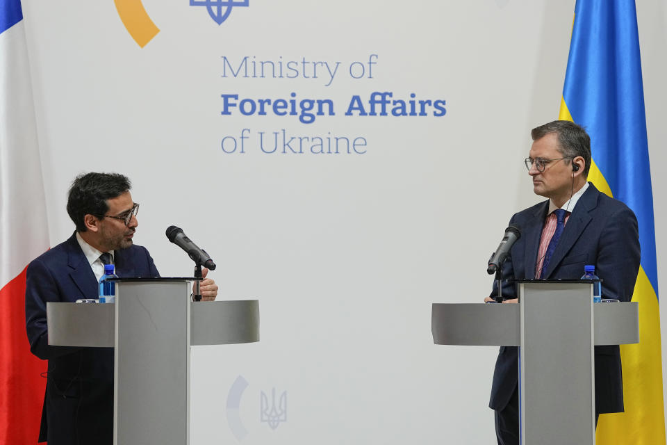 Ukraine's Foreign Minister Dmytro Kuleba, right, and his French counterpart Stephane Sejourne attend a joint press conference in Kyiv, Ukraine, Saturday, Jan. 13, 2024. (AP Photo/Efrem Lukatsky)