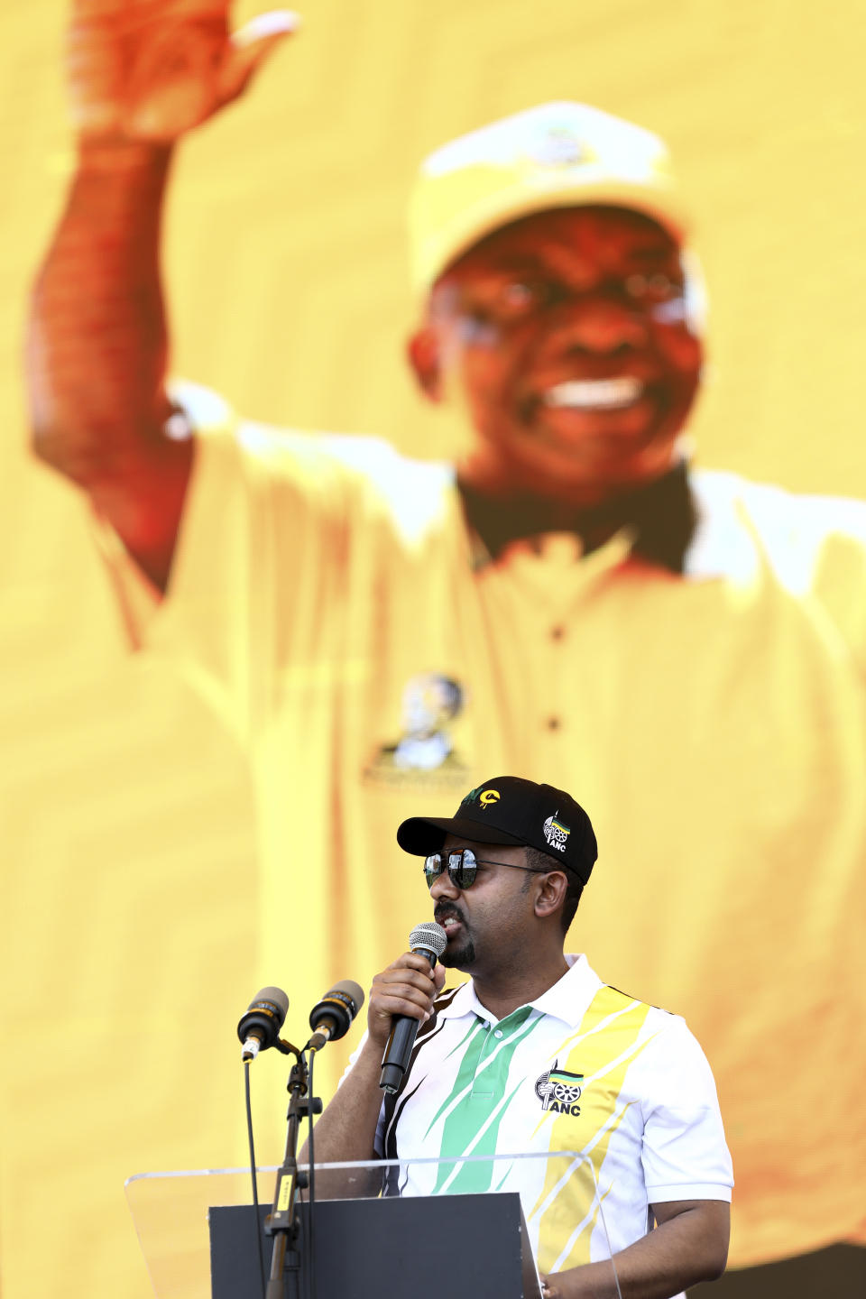 Ethiopian Prime Minister Abiy Ahmed Ali, addresses supporters in front of a backdrop showing African National Congress (ANC) president and South African President Cyril Ramaphosa, at the party's 108th birthday celebrations in Kimberley, South Africa, Saturday, Jan. 11, 2020. (AP Photo)