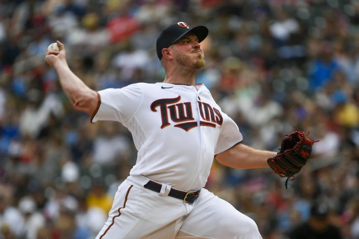 Minnesota Twins pitcher Dylan Bundy throws against the Chicago White Sox during the first inning of a baseball game, Saturday, July 16, 2022, in Minneapolis. (AP Photo/Craig Lassig)