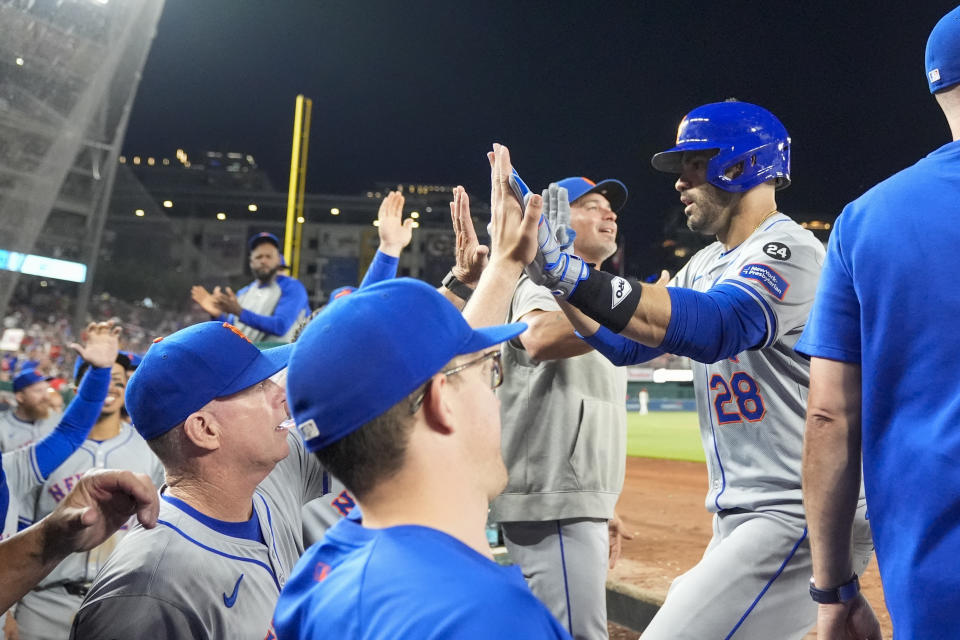 New York Mets designated hitter J.D. Martinez (28) celebrates after his three-run homer during the 10th inning of a baseball game against the Washington Nationals at Nationals Park, Monday, July 1, 2024, in Washington. (AP Photo/Alex Brandon)