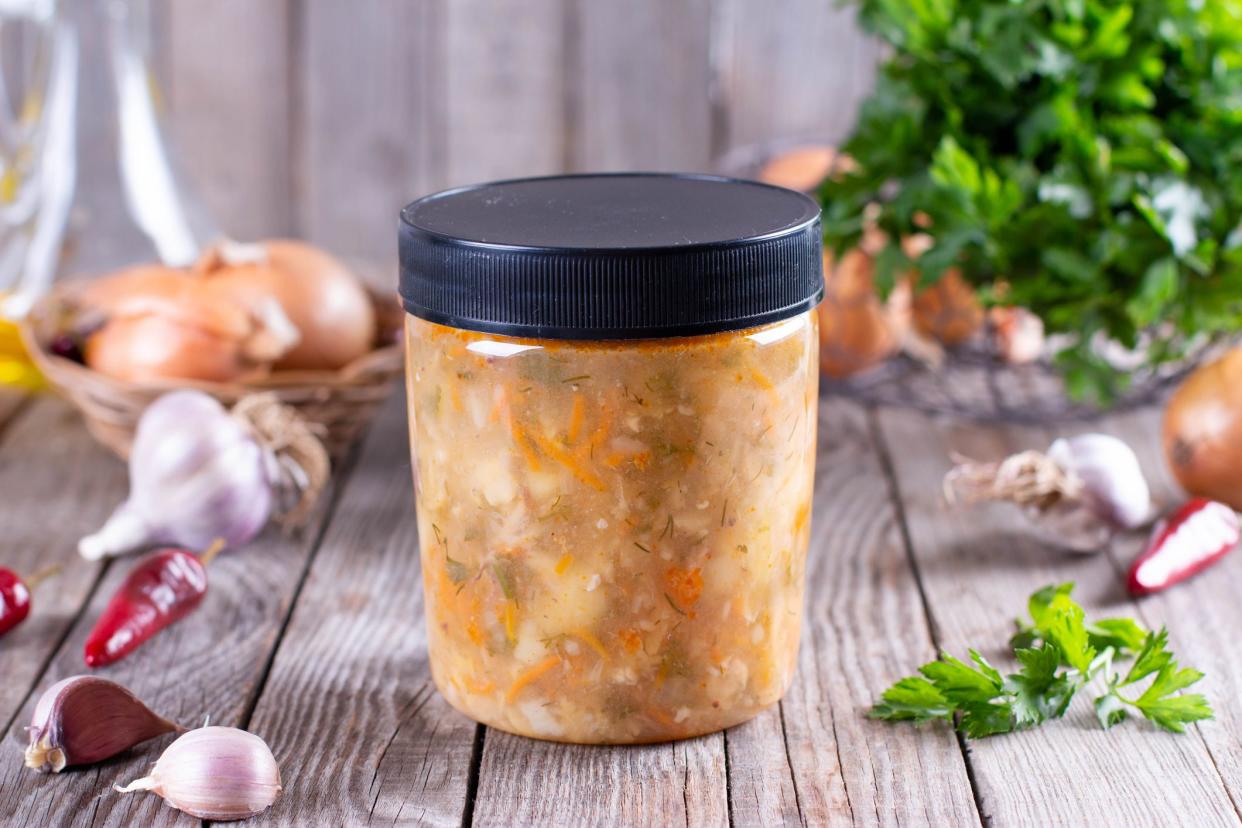 Soup in a container for further freezing. Frozen food, healthy food