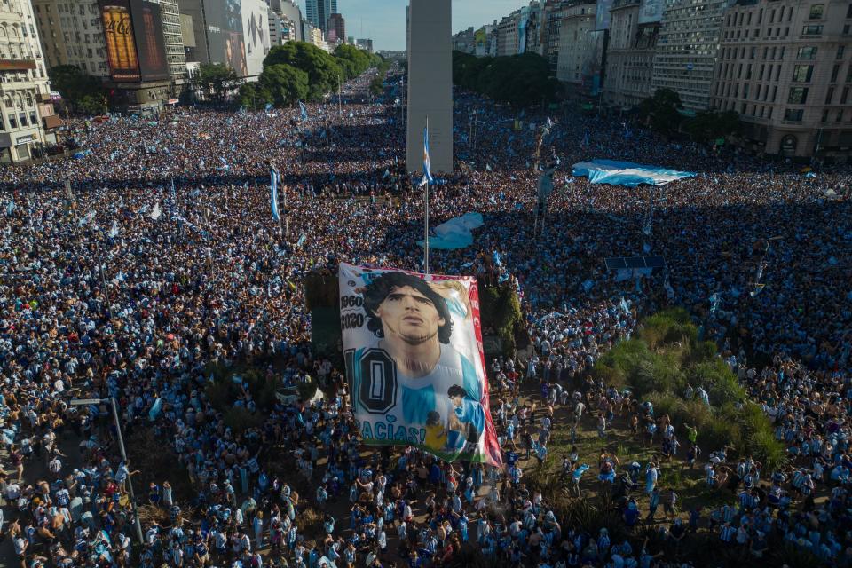 In this aerial view fans of Argentina celebrate winning the Qatar 2022 World Cup against France at the Obelisk  in Buenos Aires, on December 18, 2022. (Photo by TOMAS CUESTA / AFP) (Photo by TOMAS CUESTA/AFP via Getty Images)