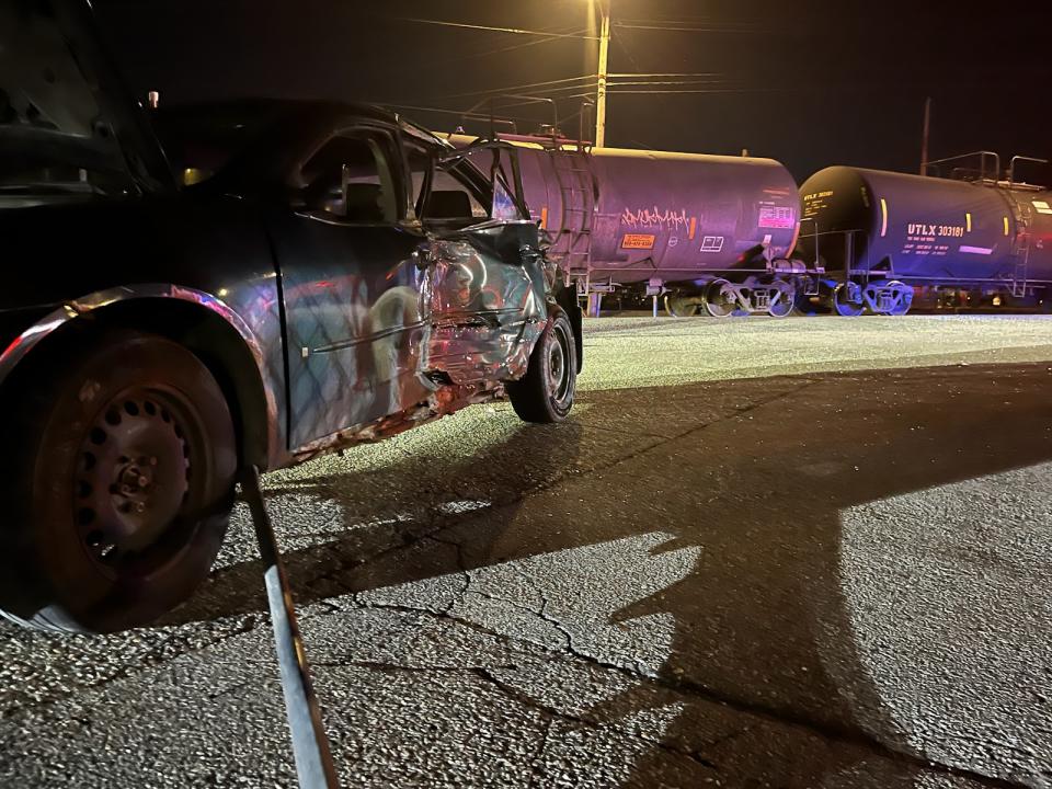 A train struck a vehicle Monday night near Euclid St. and Hosmer St. No one was injured, Lansing Fire Department reports. (Courtesy Lansing Fire Department.)
