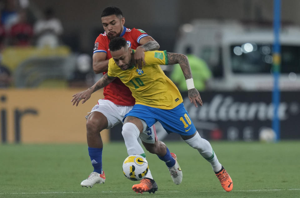 FILE - Brazil's Neymar, right, and Chile's Paulo Diaz battle for the ball during a qualifying soccer match for the FIFA World Cup Qatar 2022 at Maracana stadium in Rio de Janeiro, Brazil, Thursday, March 24, 2022. (AP Photo/Silvia Izquierdo, File)