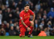 <p>Roberto Firmino is frustrated after missing an opportunity to score </p>